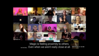 A Zoom screen shows a grid of images with names and pronouns. Some of the participants are wearing head phones and others are not. Some have a soft pink light in the background. Many are holding up their hands on the edges of the screen as if they are holding hands across space. The captioning at the bottom reads, “Magic is feeling proximity to others. Even when we aren’t really close at all.”